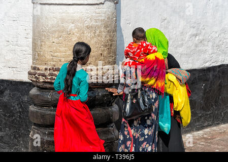 Women carrying child, Bagerhat, Khulna Division, Bangladesh Stock Photo