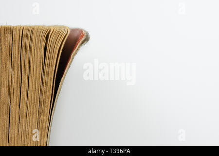 Close up image of worn corner of pages of a book. Stock Photo