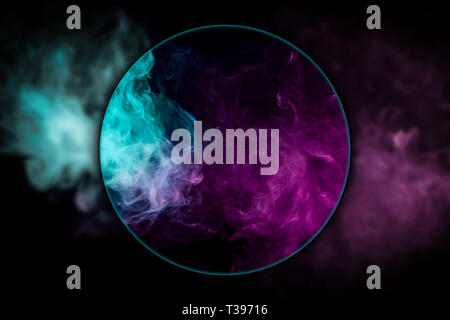Close-up  frozen abstract movement of  explosion smoke multiple colors blown under a magnifying glass on black background. Background from the smoke o Stock Photo