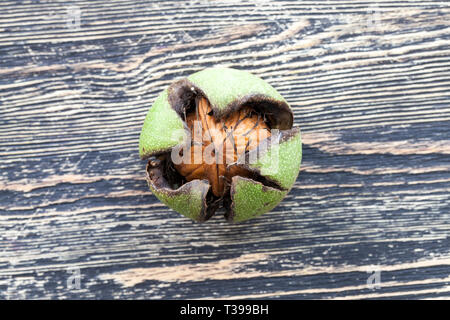 Former walnuts lying on a blackboard, foods ready to eat Stock Photo