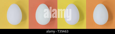 White Easter eggs on a pastel multicolor square background, banner Stock Photo