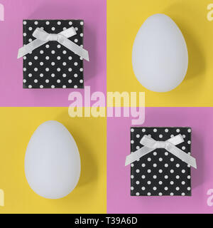Easter eggs and gift boxes, on a pink and yellow square background Stock Photo