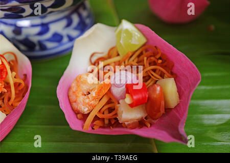 Closed Up Thai Style Fresh Lotus Flower Petal Wrapped Appetizer Called Miang kham Stock Photo