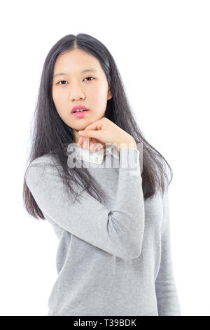 Teenage Asian high school girl with chin on hand Stock Photo