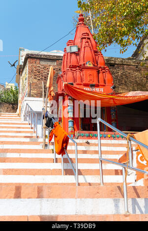 VARANASI, INDIA, MAR 10 2019 - Small Shiva temple on Embankments of the Ganges, Varanasi, India Stock Photo