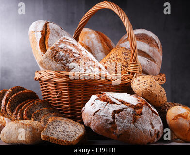 Composition with assorted bakery products in wicker basket Stock Photo