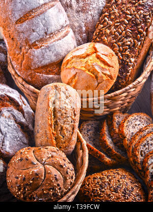 Composition with assorted bakery products in wicker basket Stock Photo