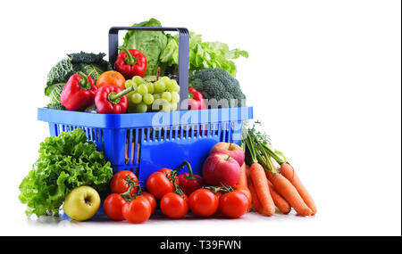 Fresh organic fruits and vegetables in plastic shopping basket isolated on white Stock Photo
