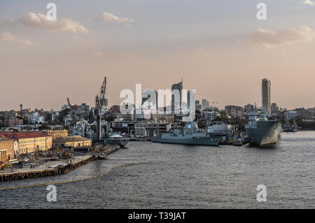 Sydney, Australia - February 12, 2019: Several large Navy ships at Royal Australian Navy Heritage Centre with housing in back under an evening twiligh Stock Photo