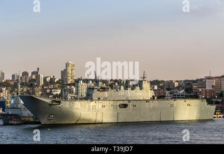 Sydney, Australia - February 12, 2019: Closeup of L02 Navy ship at Royal Australian Navy Heritage Centre with housing in back under an evening twiligh Stock Photo