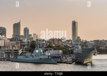 Sydney, Australia - February 12, 2019: Several large Navy ships at Royal Australian Navy Heritage Centre with housing in back under an evening twiligh Stock Photo