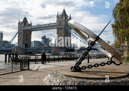 London's Tower Bridge with the Timepiece Sundial in the foreground on the north bank of the River Thames, England, UK. Stock Photo
