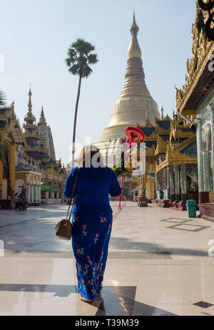 pilgrim with offering  at the Shwedagon Pagoda, officially named Shwedagon Zedi Daw and also known as the Great Dago Stock Photo