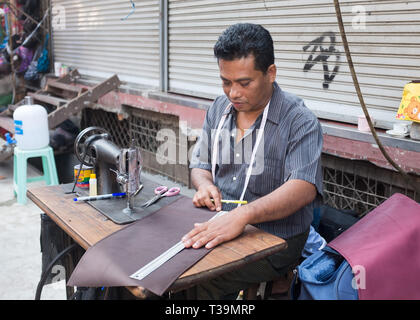 Street tailor in Bogyoke Aung San Market in Yangon, Myanmar (Burma) Stock Photo