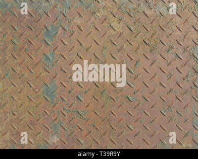 Rusty metal  floor plate for walking with fish pattern on surface Stock Photo