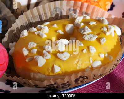 Arrangement of colorful doughnuts and easter eggs Stock Photo