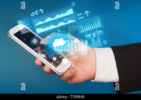 Hand using phone with cloud technology and linked information concept Stock Photo