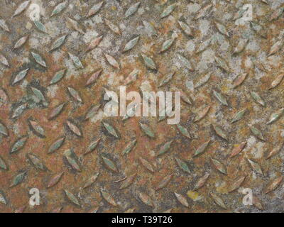 Rusty metal  floor plate for walking with fish pattern on surface Stock Photo