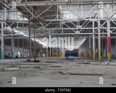 Inside of a abandoned auto factory Stock Photo