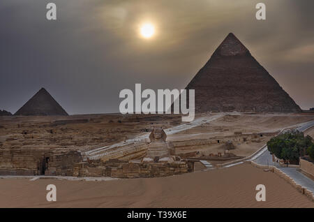 The Pyramids and the Sphinx of Giza in the twilight, Egypt Stock Photo