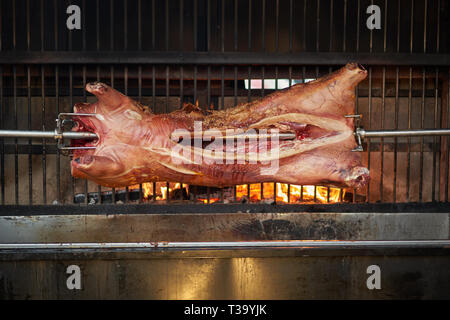 Whole hog on a roaster. Landscape format. Stock Photo