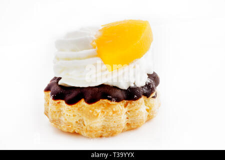 Mini puff pastry cake with fruit and cream filling Stock Photo