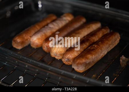 Sausages in the oven Stock Photo