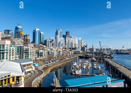 Seattle, WA - March 2019: Downtown Seattle seen from the Bell Street Pier Rooftop Deck. Stock Photo