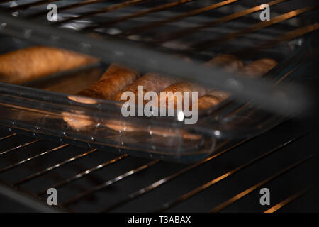 sausages in the oven Stock Photo