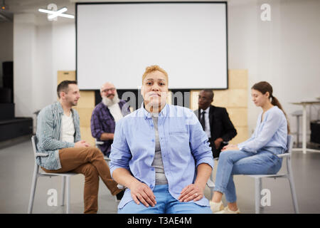 Woman Posing in Group Therapy Stock Photo