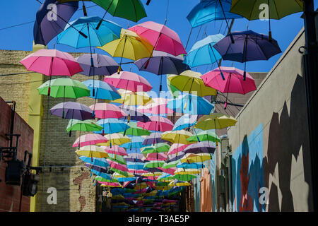 Colorful umbrellas hanging in the famous Orange Street Alley at Redlands, California Stock Photo