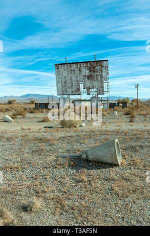 Abandoned drive in theatre and overgrown parking area Stock Photo