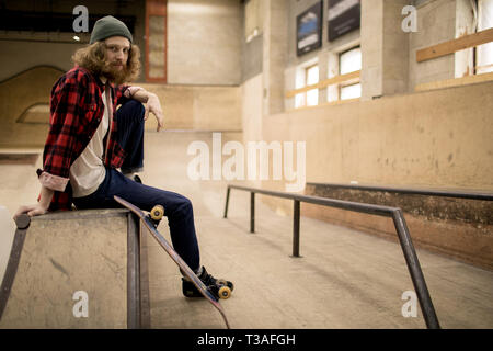 Long Haired Man in Skate Park Stock Photo