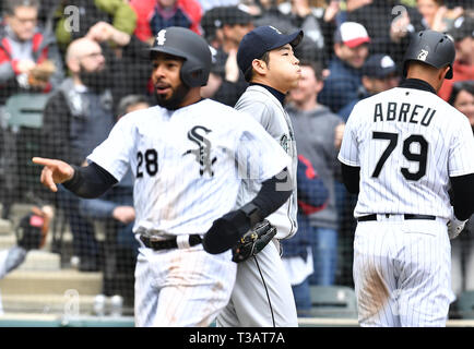 Seattle Mariners starting pitcher Yusei Kikuchi (C) looks dejected as Chicago White Sox's Leury Garcia (L) celebrates after scoring on a two-run single hit by Tim Anderson (not pictured) in the second inning during the Major League Baseball game at Guaranteed Rate Field in Chicago, Illinois, United States, April 5, 2019. Credit: AFLO/Alamy Live News Stock Photo