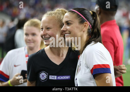 Los Angeles, CA, USA. 7th Apr, 2019. United States of America forward Alex Morgan (13) poses with a fan after the game between Belgium and USA at Banc of California Stadium in Los Angeles, CA. USA. (Photo by Peter Joneleit) Credit: csm/Alamy Live News Stock Photo
