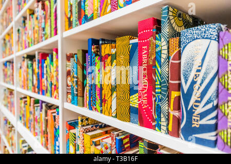 London, UK. 08th Apr, 2019. The British Library an installation by Yinka Shonibare CBE, at Tate Modern, having just been acquired by them. Highlighting the impact of immigration on British culture, it is a site-specific installation with a digital platform for visitors to join in the discussion.It contains 6,328 books bound in ‘Dutch wax print. The installation also contains an area for audiences to access information about the project on tablets. It was purchased with Art Fund support and funds provided by the Tate International Council, the Africa Acquisitions Committee, Wendy Fisher and THE Stock Photo