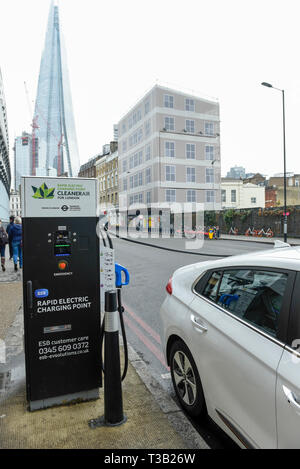 London, UK.  8 April 2019.  An electric car in Southwark is charged at a fast roadside charging point. Electric cars are exempt from the Ultra Low Emission Zone which is in force 24 hours a day.  Coming into effect on 8 April, within the same area of central London as the Congestion Charge, most vehicles, including cars and vans, need to meet the ULEZ emissions standards or their drivers must pay a daily charge to drive within the zone.  The ULEZ is an initiative to improve air quality and public health in central London and is supported by the Mayor of London. Credit: Stephen Chung / Alamy Li Stock Photo