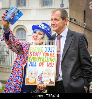 Westminster, UK, 08th April 2019. Activist Madeleine Kay has a selfie with Alastair Campbell. Sodem, group of Anti-Brexit protesters outside the Houses of Parliament in Westminster have organised a 'Brexit Sing Off', and are joined by Yorkshire for Europe, opera singer Dame Sarah Connolly, journalist and former Labour Communications Director Alastair Campbell and others for a musical protest against Brexit. Credit: Imageplotter/Alamy Live News Stock Photo