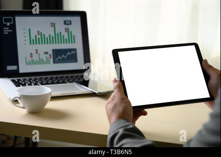 man  hands multitasking man using tablet close up close up working in office Stock Photo