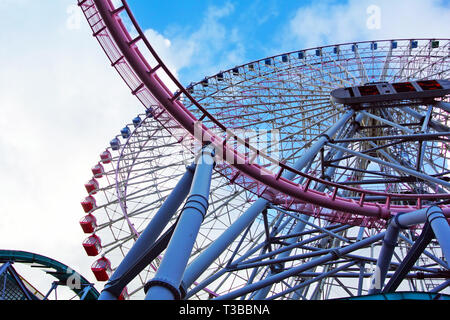 Giant ferris wheel called 'Cosmo Clock 21' at  Cosmo World amusement park Stock Photo