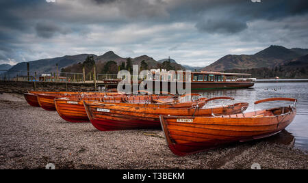 Rowing boats lying on beach at Derwentwater Keswick  in the Lake District, England Stock Photo