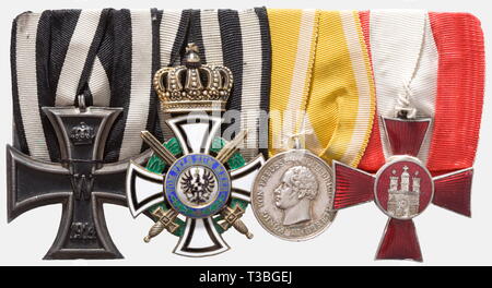 Friedrich Christiansen, most successful naval aviator of WWI a miniatures chain, orders clasp and decorations, Miniature stickpin for the Naval Aircraft Pilot's Badge, silver, gilt, punched '800', also a five-piece miniatures chain with the Hamburg Hanseatic Cross, Prussian Silver Lifesaving Medal, Knight's Cross with Swords of the Royal House Order of Hohenzollern, Iron Cross 2nd Class of 1914 and t historic, historical, 1910s, 20th century, troop, troops, armed forces, military, militaria, army, wing, group, air force, air forces, object, objec, Additional-Rights-Clearance-Info-Not-Available Stock Photo