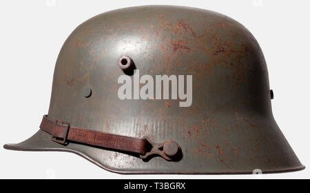 A German model 1916 steel helmet, First World War Period Field grey lacquered shell with small spots of rust. Complete interior lining consisting of the leather ring and leather padding pouches. Leather chinstrap attached to the outside of the helmet on model 91 fasteners. Cf. Ludwig Baer, 'Vom Stahlhelm zum Gefechtshelm,' vol. 1, p. 103 with illustrations and Michael J. Haselgrove & Branislav Radovic, 'Helmets of the First World War - Germany, Britain & Their Allies', p. 47. Extraordinarily rare model - only two helmets of this type with the str, Additional-Rights-Clearance-Info-Not-Available Stock Photo