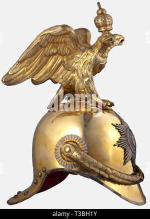 A Russian helmet for officers of the Tsar's Garde à Cheval, after 1900 Tombac skull with a gilded helmet eagle and a silver-plated emblem in the shape of the star of the Order of St. Andrew with a gilded and enamelled centre (partly restored). A Cyrillic inscription, 'Shuvalova', scratched on the skull below the star. Gilded convex metal chinscales with velvet backing, on rosette pins stamped with the Cyrillic inscription 'Nakl. Zolot.' Black/orange coloured metal cockade on the right. Brown leather sweatband. Fine blue silk lining. Front peak li, Additional-Rights-Clearance-Info-Not-Available Stock Photo