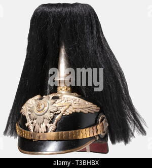 A helmet for officers, of the Prussian Pioneer or Railroad Guard Battalions Black-lacquered fiber body, silver-plated mountings, Guard eagle. The centre of the guard star is enamelled. Gilded star screws and flat metal chinscales. Replacement silk lining. Along with the service spike, it comes with the falling, black buffalo hair plume with silver-plated holder. Good overall condition, signs of age and wear. historic, historical, 19th century, Prussian, Prussia, German, Germany, militaria, military, object, objects, stills, clipping, clippings, c, Additional-Rights-Clearance-Info-Not-Available Stock Photo