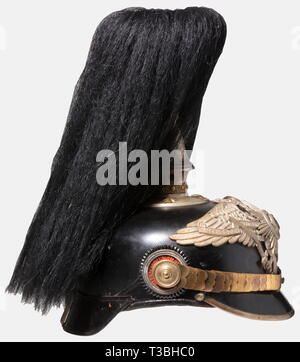 A helmet for officers, of the Prussian Pioneer or Railroad Guard Battalions Black-lacquered fiber body, silver-plated mountings, Guard eagle. The centre of the guard star is enamelled. Gilded star screws and flat metal chinscales. Replacement silk lining. Along with the service spike, it comes with the falling, black buffalo hair plume with silver-plated holder. Good overall condition, signs of age and wear. historic, historical, 19th century, Prussian, Prussia, German, Germany, militaria, military, object, objects, stills, clipping, clippings, c, Additional-Rights-Clearance-Info-Not-Available Stock Photo