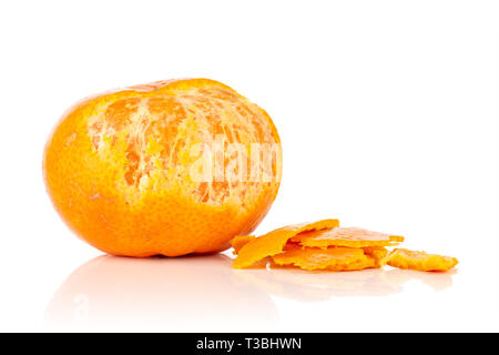 One whole fresh orange mandarine rind pieces around one fruit is half peeled isolated on white background Stock Photo
