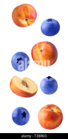Flying slice peach and blueberry fruits isolated on white background with clipping path as package design element and advertising. Stock Photo