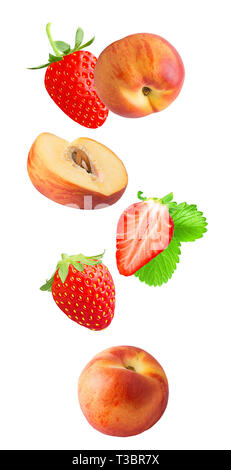 Flying fresh slice peach and strawberry fruits isolated on white background with clipping path as package design element and advertising. Stock Photo