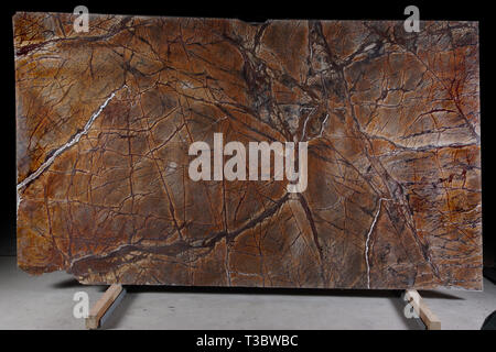Natural stone brown marble with an interesting pattern is called Bidasar Brown. Stock Photo